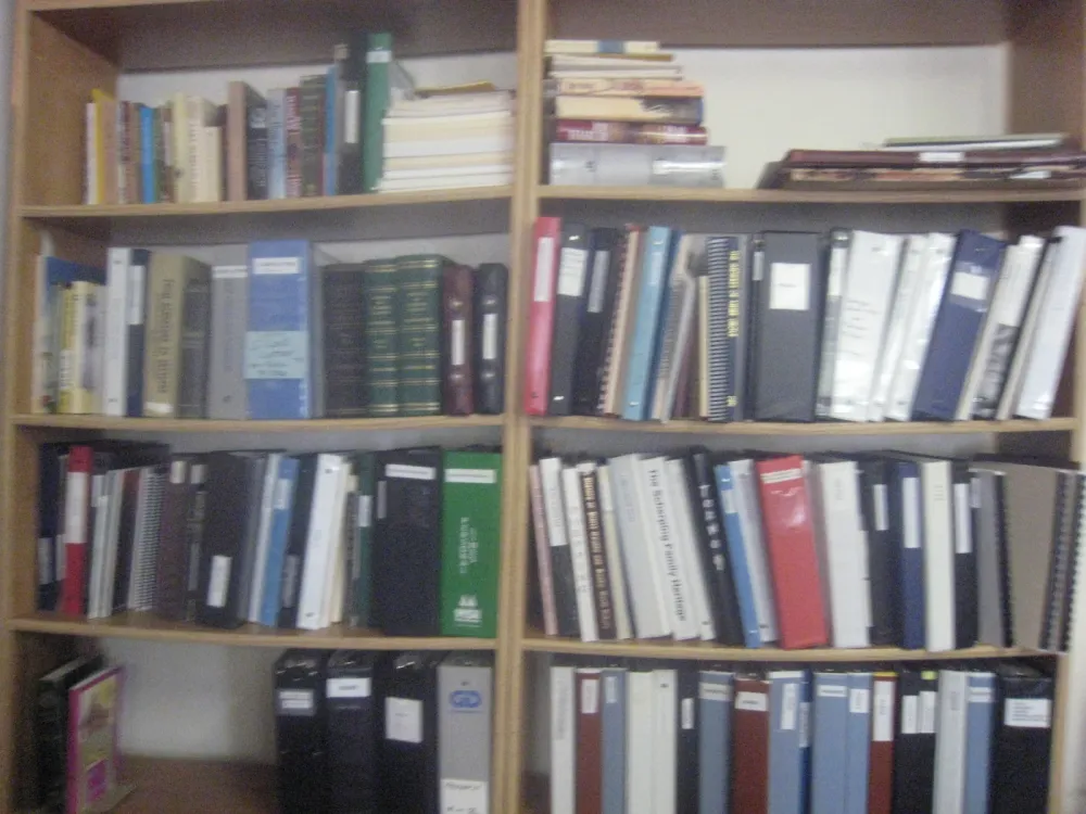 Shelves of family history binders and books in the research center
